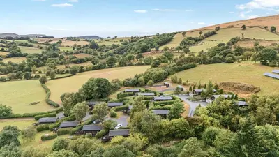 an aerial view of a village in the hills at Sunny View in Rhayader