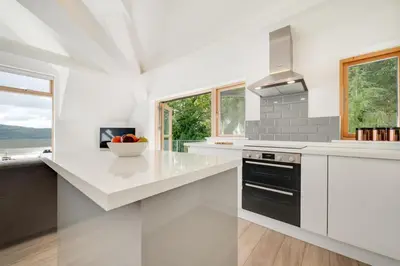 a kitchen with white countertops and a stove top oven at 2 Bed in Aberdyfi oc-wah694 in Aberdyfi