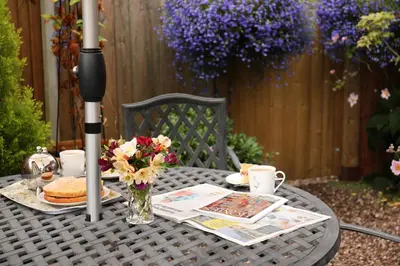 an outdoor table with a tableablish at Oakland Cottage in Craven Arms