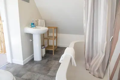 a white bathroom with a sink and a shower at Finest Retreats - 1 Bed Llangollen Cottage - Sleeps 2 in Llangollen