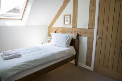 a bed in a room with a window at Finest Retreats - 2 Bed Llangollen Cottage - Sleeps 4 in Llangollen