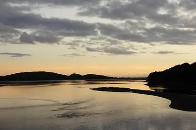 a view of a river at sunset at Abergafren Lodge in Porthmadog