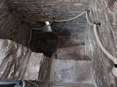an overhead view of a staircase in a stone building at Ty Fferm Hen, Ancient Farmhouse, Coity Bach in Talybont