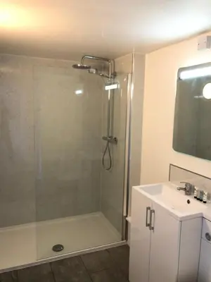 a bathroom with a shower and a sink at 9 Bromleys Court in Church Stretton