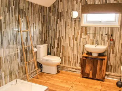 a bathroom with a toilet and a sink at The Boars Head Pub in Bishops Castle