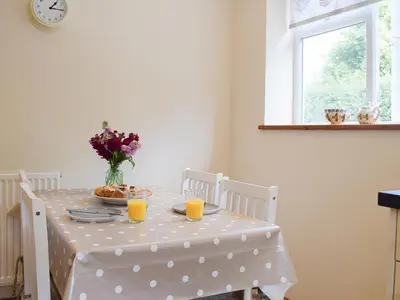a table with a polka dot table cloth and orange juice at Herrock View in Evenjobb