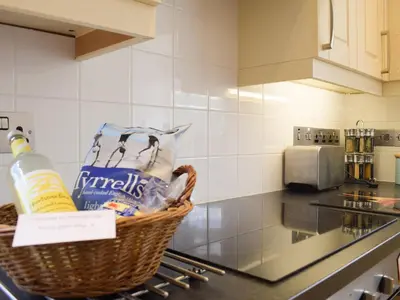 a basket of groceries sitting on a counter in a kitchen at Herrock View in Evenjobb