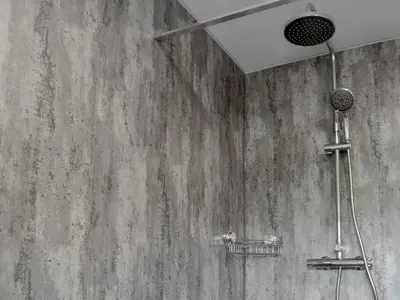 a shower in a bathroom with a concrete wall at Caffi Sali - Weluk143 in Blaenpenal