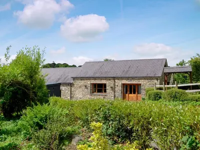 a stone house with a slate roof at Caffi Sali - Weluk143 in Blaenpenal