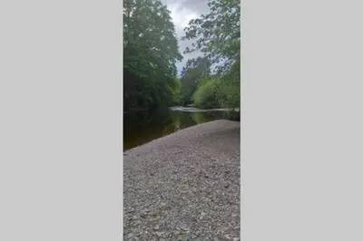 a picture of a river with trees in the background at 8F Lakeside Lodge Caer Beris Builth Wells - No Tradesman in Builth Wells