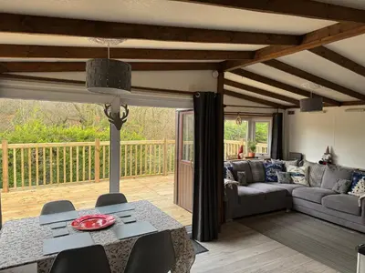 a living room with a couch and a table at 8F Lakeside Lodge Caer Beris Builth Wells - No Tradesman in Builth Wells