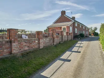 an old brick building on the side of a road at Conquer Hall in Montgomery