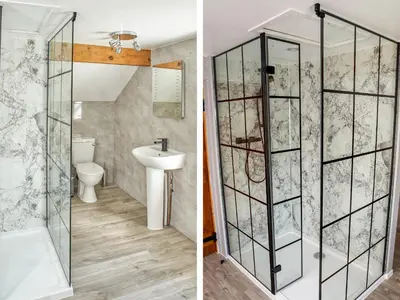 a bathroom with a glass shower and a sink at Conquer Hall in Montgomery