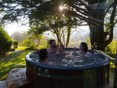 a group of people in a hot tub at Cae'r Blaidd Country House in Ffestiniog