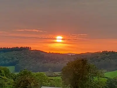 a sunset from the roof of a house at The Hideaway in Highgate