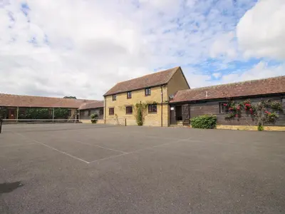 an empty parking lot in front of a building at Norton Cottage in Craven Arms