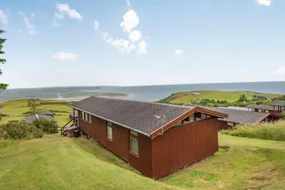 a house on the hill with a view of the ocean at The Look Out in Aberdyfi
