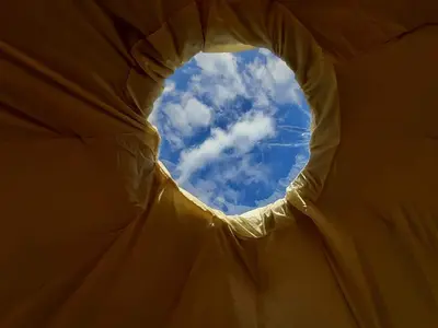 a view of the sky from inside a tent at Cae Mawr Yurt Off-Grid Glamping in Machynlleth