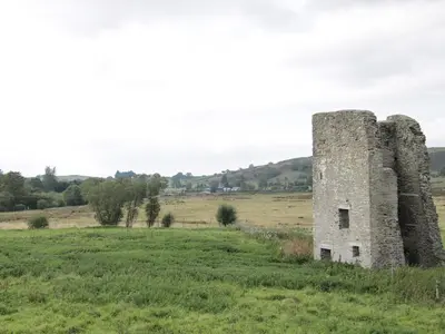 an old stone tower in a field at Jacob's Meadow in Shrewsbury