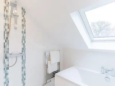 a bathroom with a sink and a skylight at Ty Arth - Uk31652 in New Quay