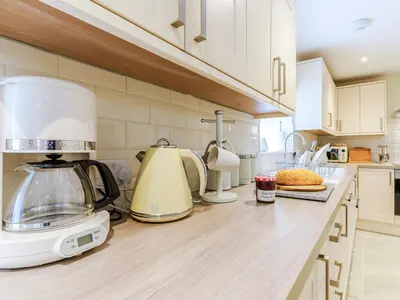 a kitchen counter with a toaster and a blender on it at Ty Arth - Uk31652 in New Quay