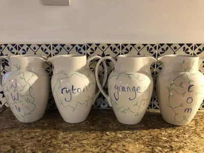 a group of three vases sitting on a counter at the garden room in Shrewsbury