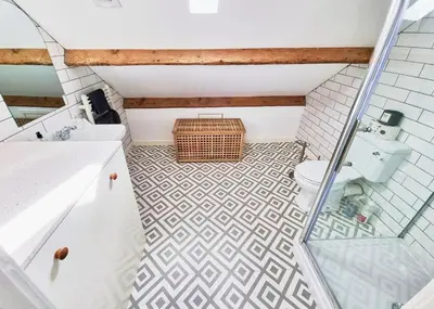 a bathroom with a toilet and a glass shower at Eldon Row - Stylish Character Apartments - Central Location 1 & 2 bed available in Dolgellau