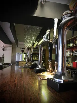 a bar with two machines on top of a counter at The White Horse Inn, Clun in Clun