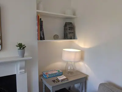 a lamp on a table next to a wall at Luxury townhouse in town centre, views, river walk, Free Parking in Shrewsbury