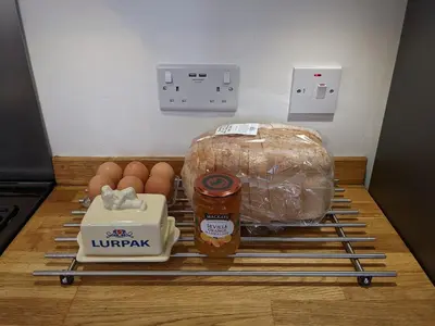 a counter with eggs and a loaf of bread and food at Luxury townhouse in town centre, views, river walk, Free Parking in Shrewsbury