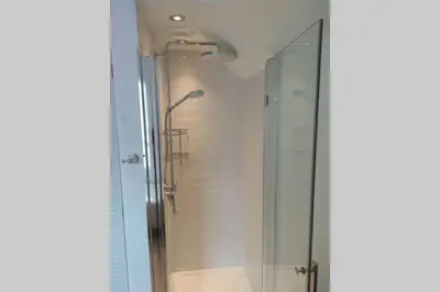 a shower in a bathroom with a glass shower stall at Luxury townhouse in town centre, views, river walk, Free Parking in Shrewsbury