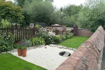 a garden with a fence and some plants at Luxury townhouse in town centre, views, river walk, Free Parking in Shrewsbury