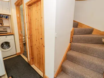 a staircase in a tiny house at Redwood in Harlech