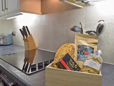 a box of food on a counter in a kitchen at Bristol House in New Quay