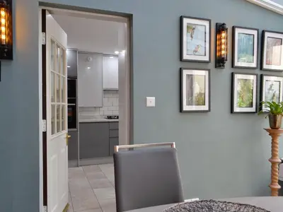 a dining room with a table and a chair at The Apartment in Brecon