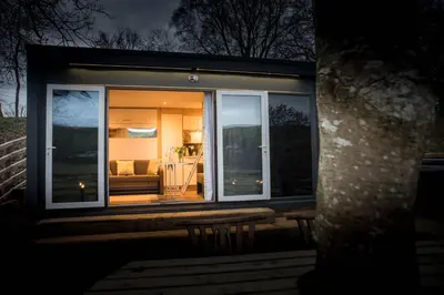 a small house with a view of a living room at The Fox Den in Rhayader