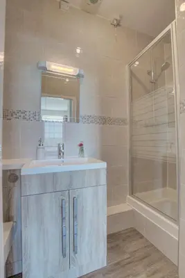 a bathroom with a sink and a shower at 3 Bed in Welshpool oc-bow122 in Welshpool