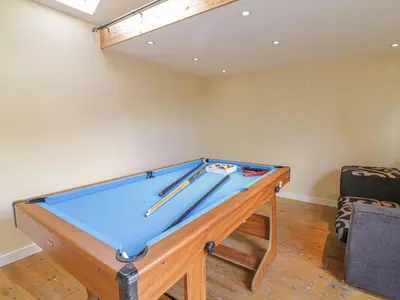 a pool table in the corner of a room at 1 Rhys Terrace in Pennal
