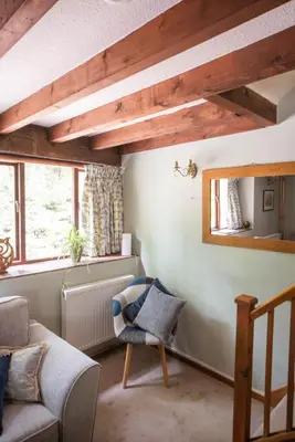 a living room with a couch and a window at Lower House B&B and Cottages, Adforton in Leintwardine