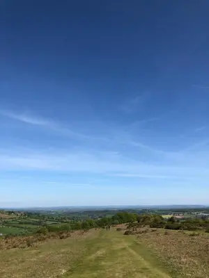 a group of people standing on top of a hill at The Calf Cotts in Pembridge