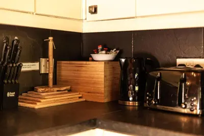 a kitchen counter top with a coffee maker and a toaster at Stunning Log Cabin with Garden in Snowdonia - Hosted by Seren Short Stays in Trawsfynydd