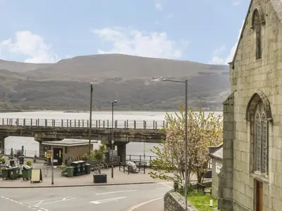 a view of a bridge over a body of water at Emerald Suite in Barmouth