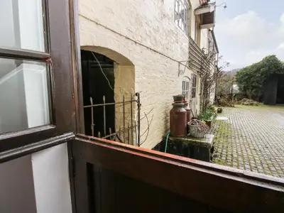 an open window of a building with a street at The Wheelhouse at Dudgeley Mill in Church Stretton