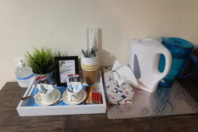 a tray with cups and utensils on a table at 15 Bronant in Talgarth