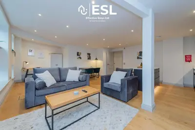 a living room with a couch and two chairs and a table at Modern 2 Bedroom Church Apartment 5 Mins to Town Centre - Free Parking in Shrewsbury