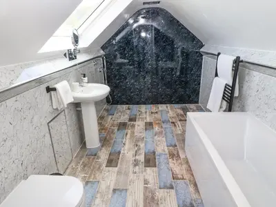 a bathroom with a sink and a toilet at Y Granar The Granary in Oswestry