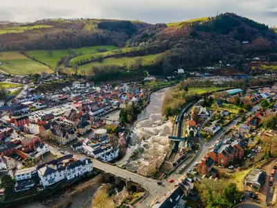 an aerial view of a town with a river at Fern Studio 1 Bedroom Apartment in Llangollen