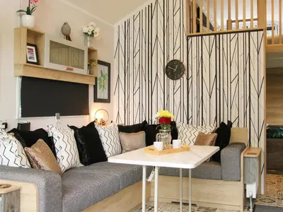 a living room with a couch and a table at Jacob's Meadow Pod 2 in Shrewsbury