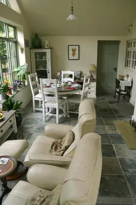 a living room with a couch and a table at The Old Vicarage in Shrewsbury