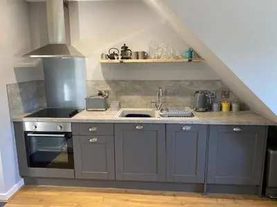 a kitchen with a sink and a stove at Ty Gles in Derwenlas